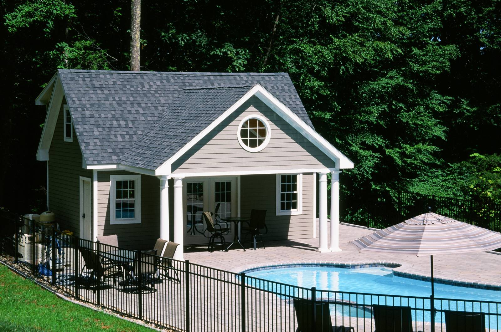 16' x 24' pool house • 18' x 10' front overhang with vaulted ceiling • LP Smart Siding • Harvey vinyl insulated windows • French doors