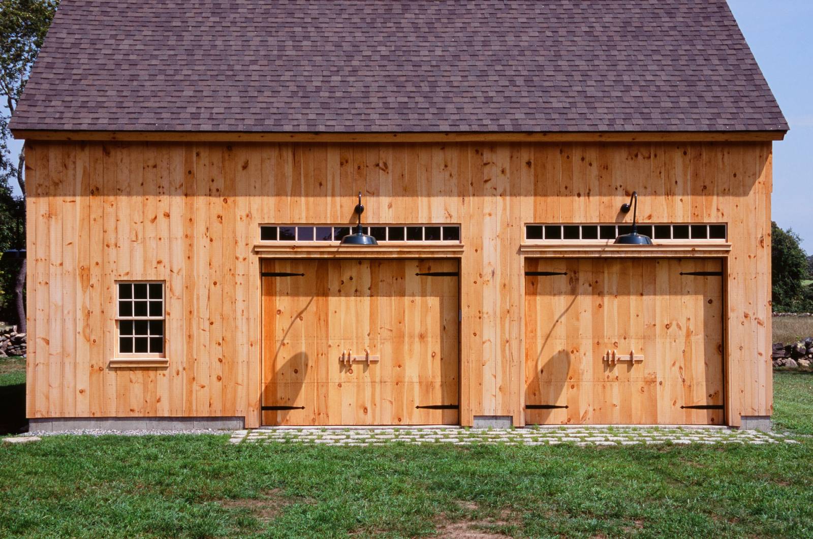 Pine faced garage doors with transoms above