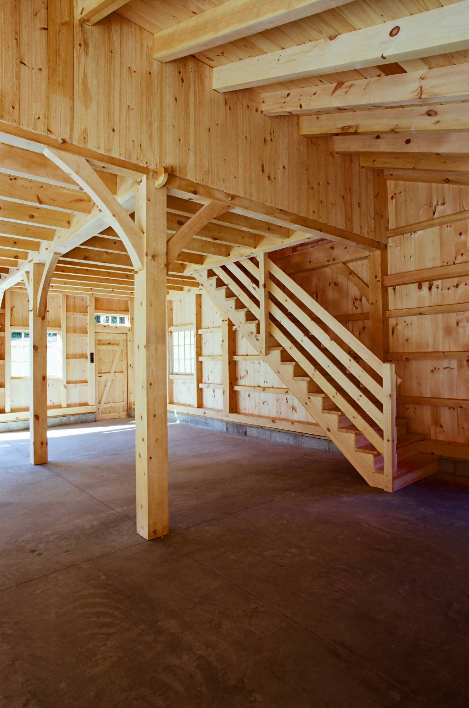 Anchorbeam Joinery •Â Arched Braces •Â Heavy Timber Pine Stairway to Second Floor