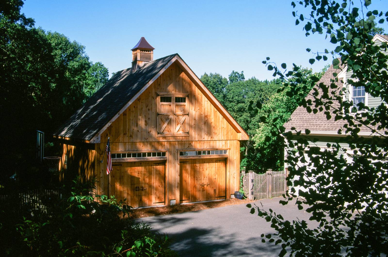 Exceptionally built custom garage • hayloft doors • pine cupola