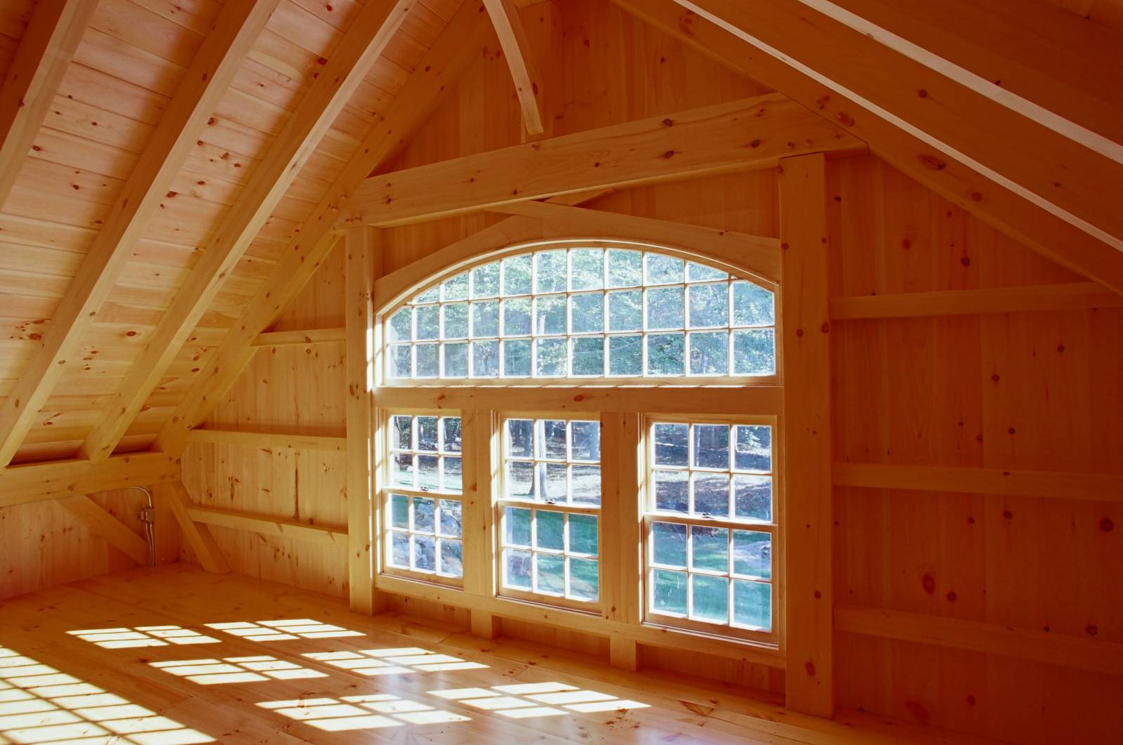 Intricate interior framing of bow top window