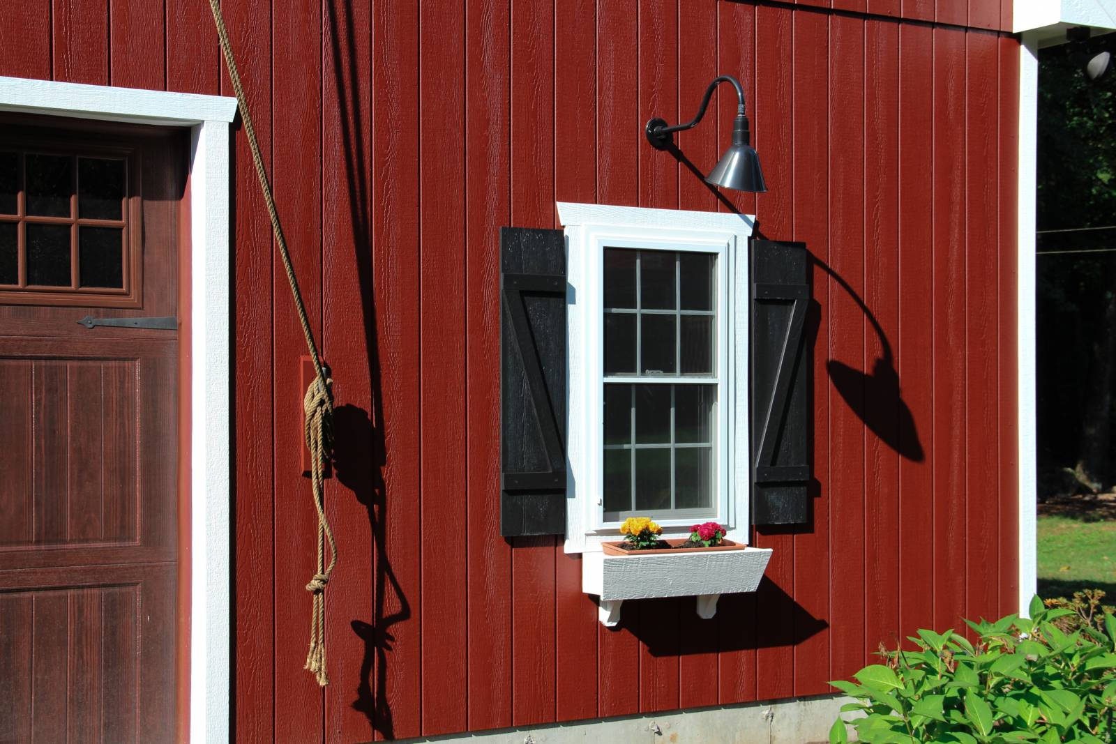 Insulated Double Hung Window with Black Z-Style Shutters • White Trim • Flowerbox • Rope from Trolley Beam Pulley