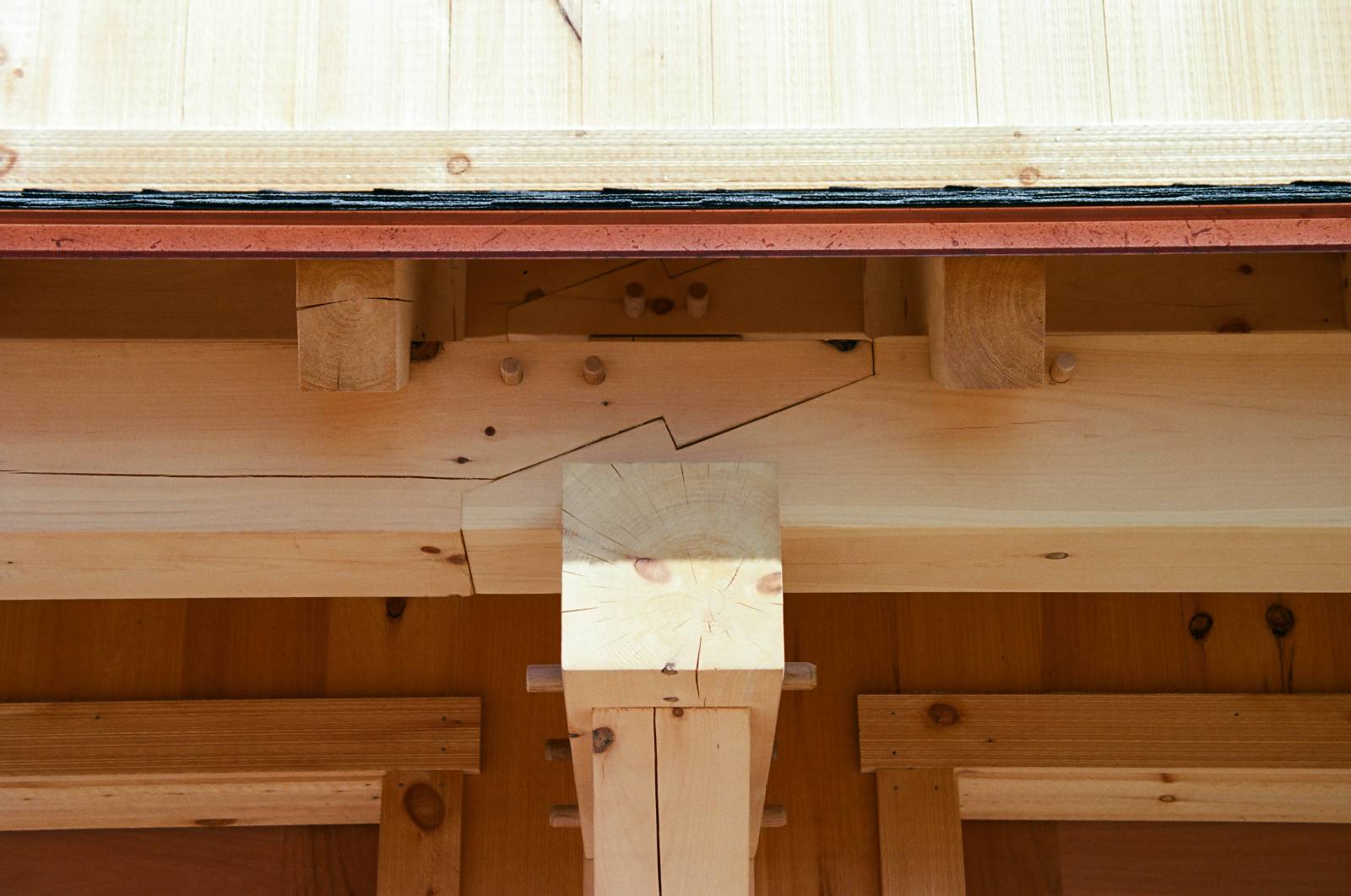 Closeup: scarf joinery in the timber frame eyebrow roof
