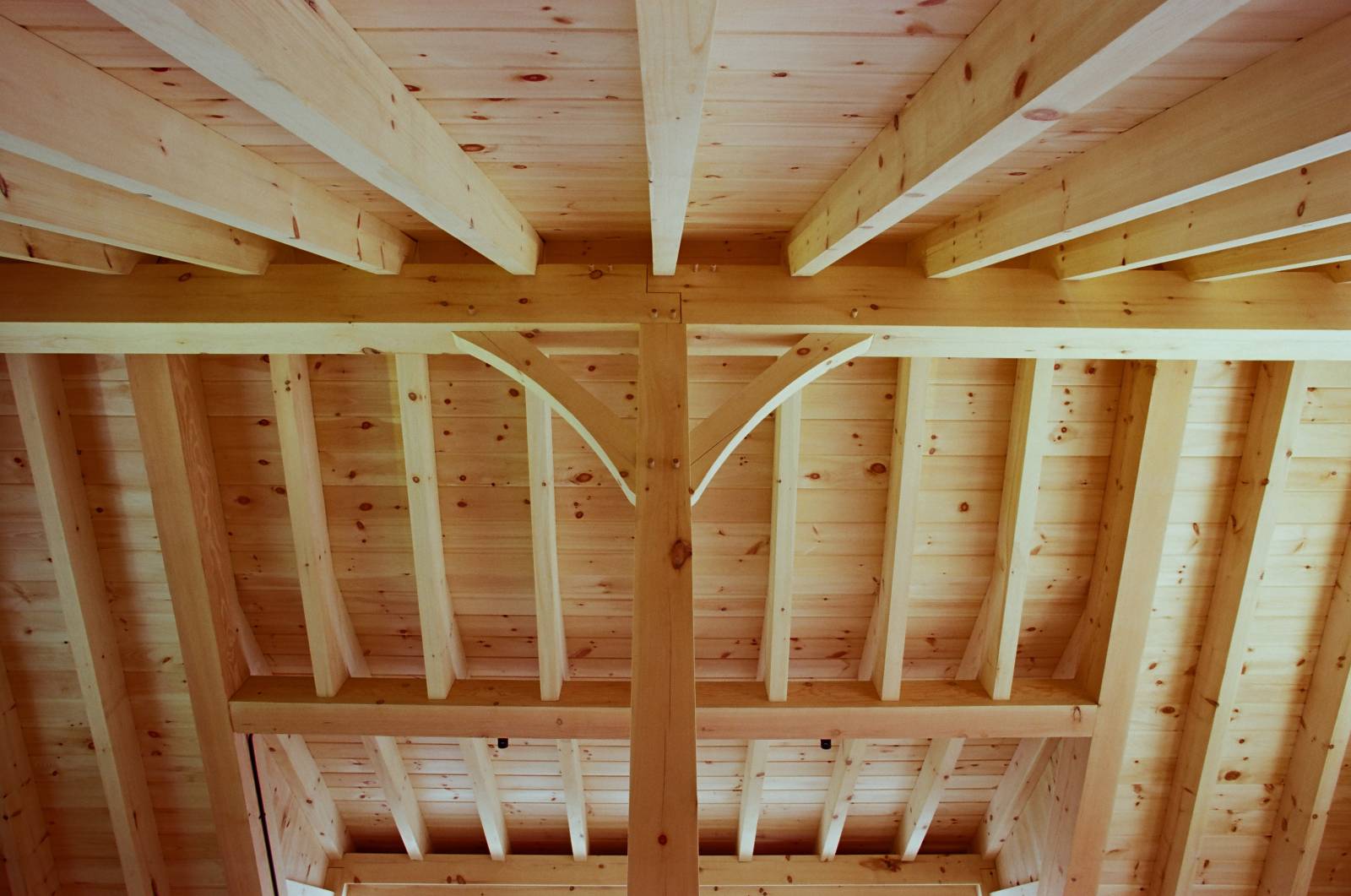 Looking up at the structural ridge beam and timber rafters