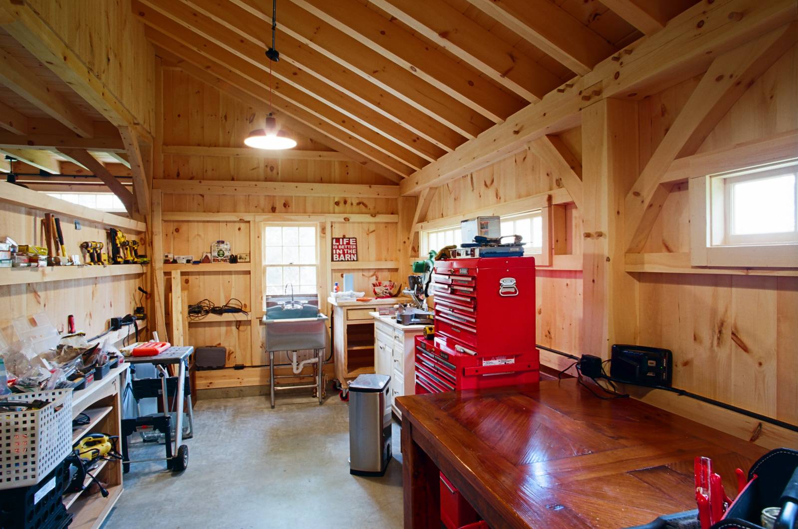 A workshop inside the post & beam barn's 10' x 24' lean-to