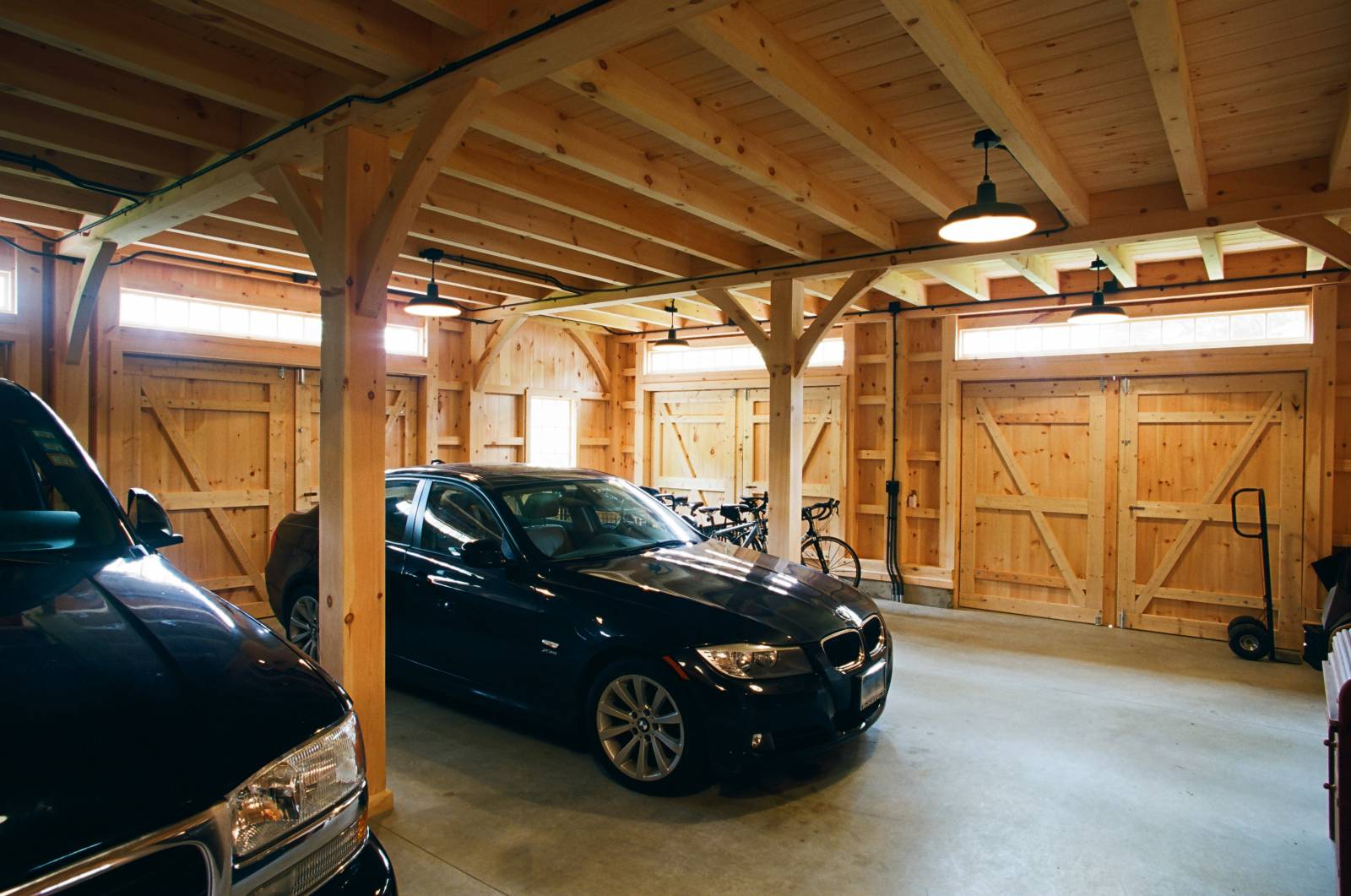 This post & beam barn interior has a 2-car garage