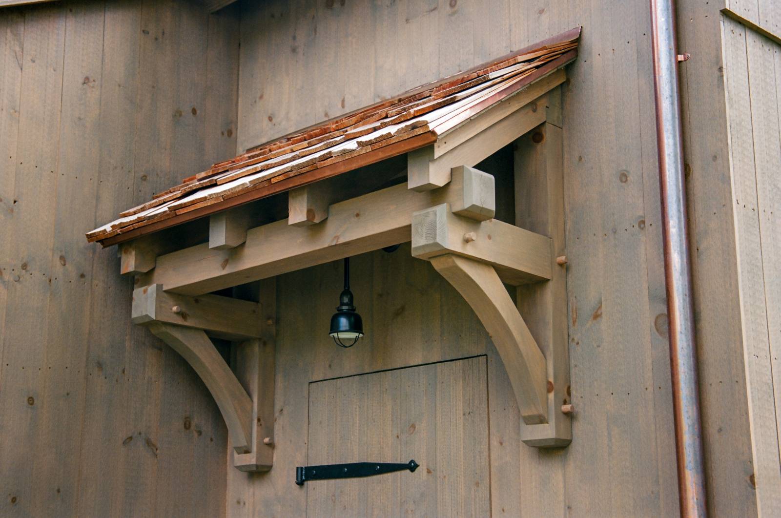 Timber frame eyebrow roof