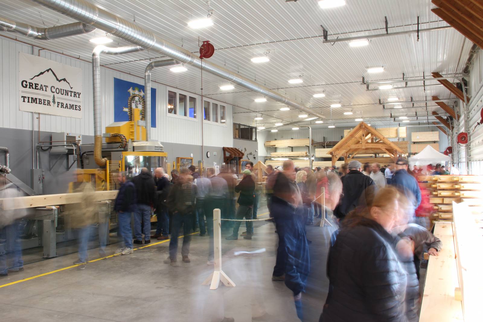 A large crowd moves through the manufacturing & design facility at Great Country Timber Frames during the fourth annual Open House