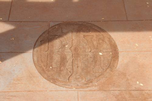 Brand in stamped concrete floor