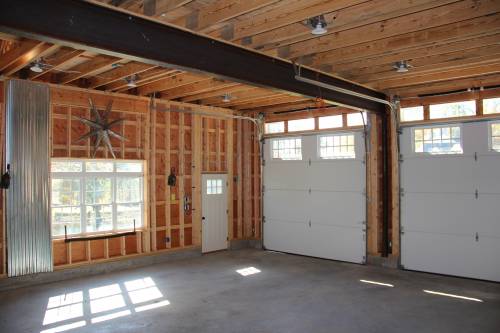 Clear span steel beam and oversized garage doors