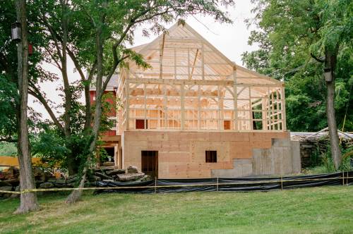 The barn addition is 3 levels: tractor barn below - workshop main level - office third level