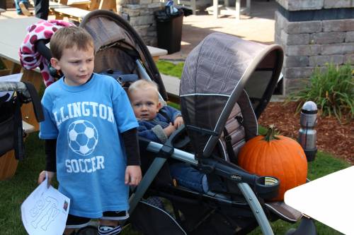 Template in hand and pumpkin in stroller