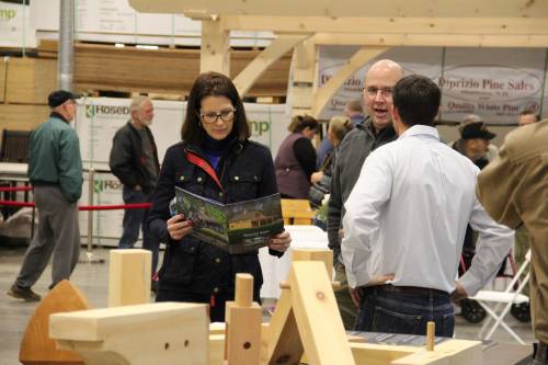 Chris educates visitors about joinery