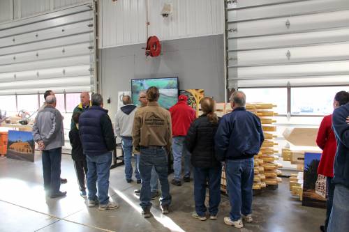 Visitors learn about the timber frame raising process