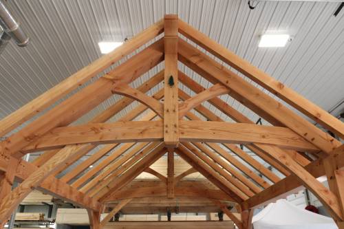 King post truss & rafters on the Teton timber frame pavilion on display