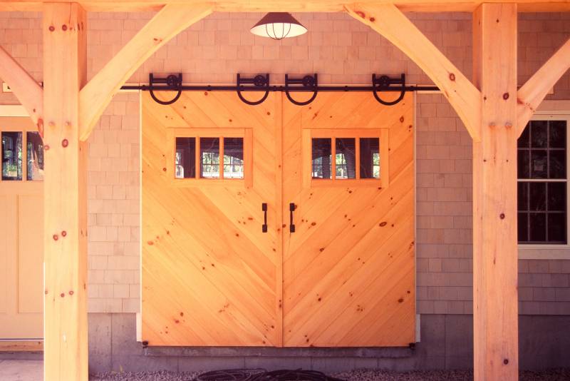 Sliding barn doors with herringbone pattern and glass