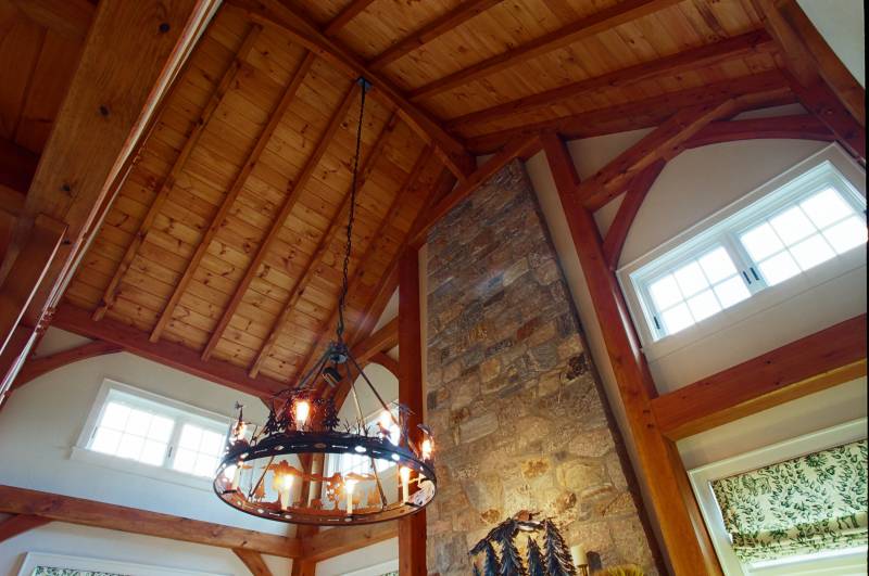 Cathedral Ceilings & Arched Beam in Timber Frame Living Room