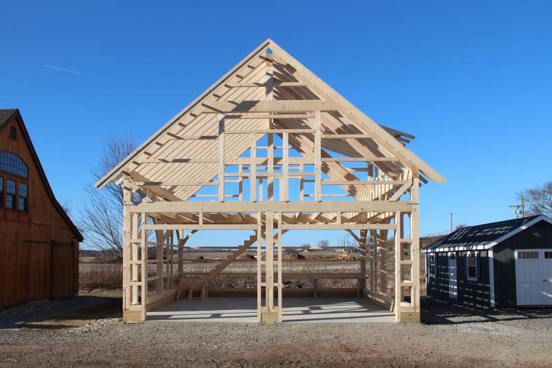 Straight-on view of the timber frame barn