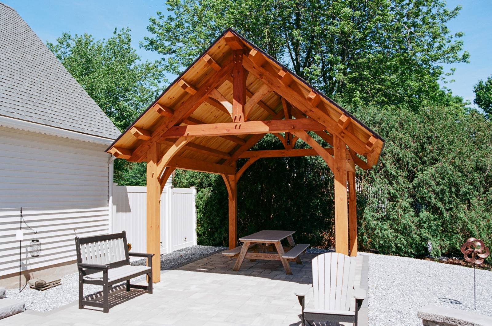 Timber frame pavilion with traditional common purlins & king post truss at the heart of this outdoor living space