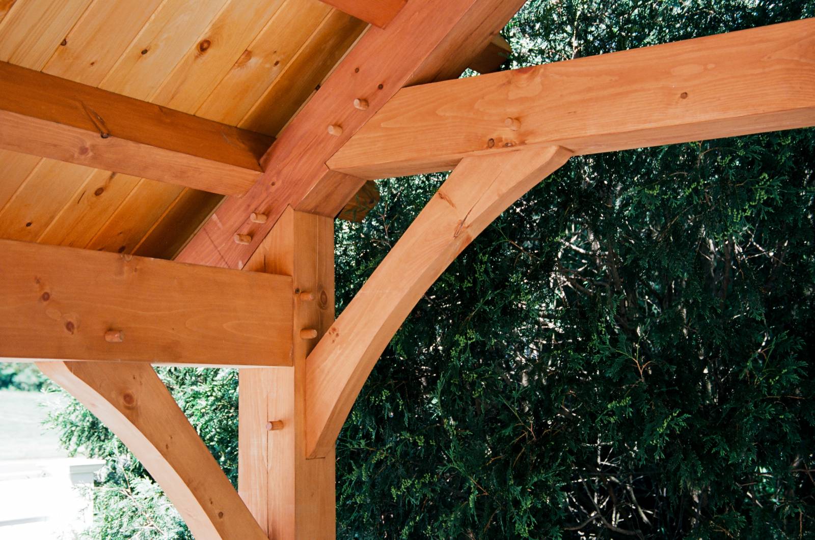 Timber frame joinery closeup: arched kneebrace