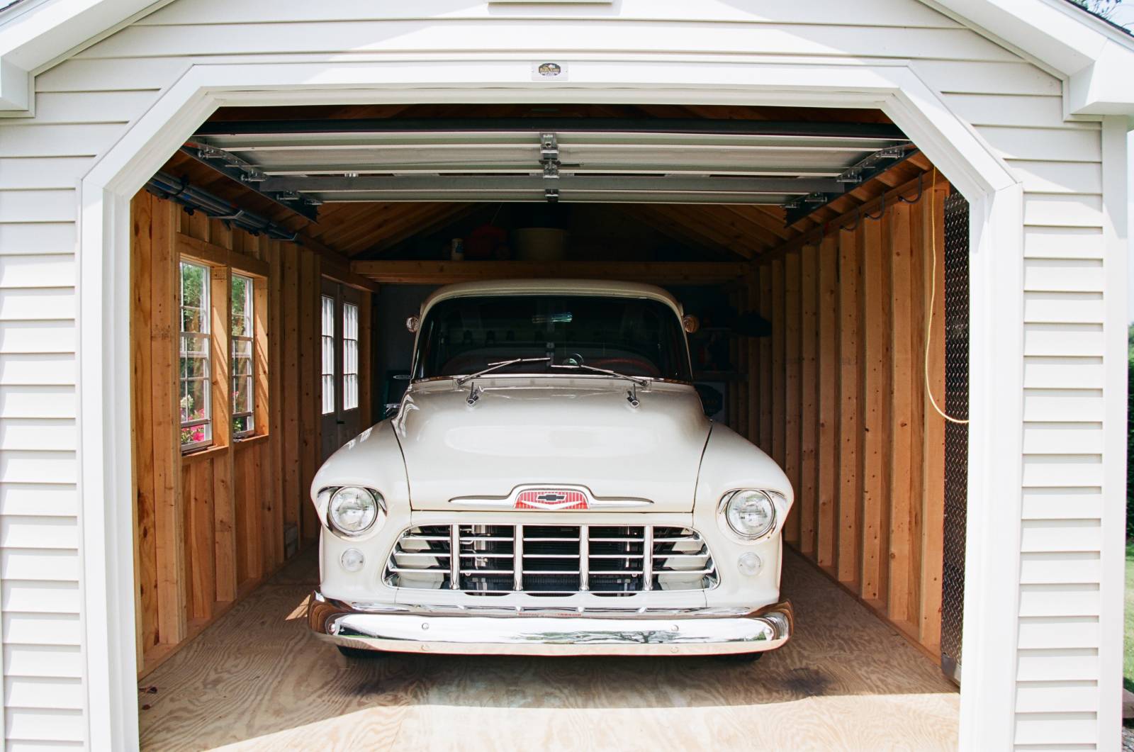Plenty of space for a classic car in this Traditional Cape Garage with Super Floor