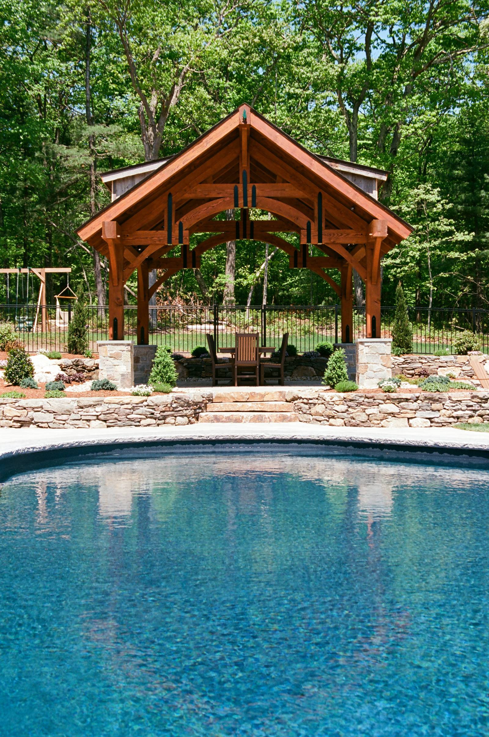 Front View of the Alpine Timber Frame Pavilion by a Pool