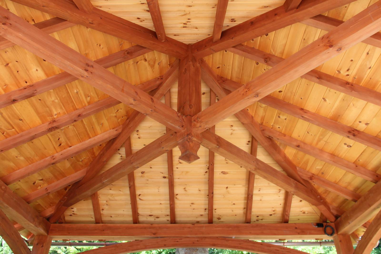 Boss pin • exposed tongue & groove pine ceiling with heavy timber rafters