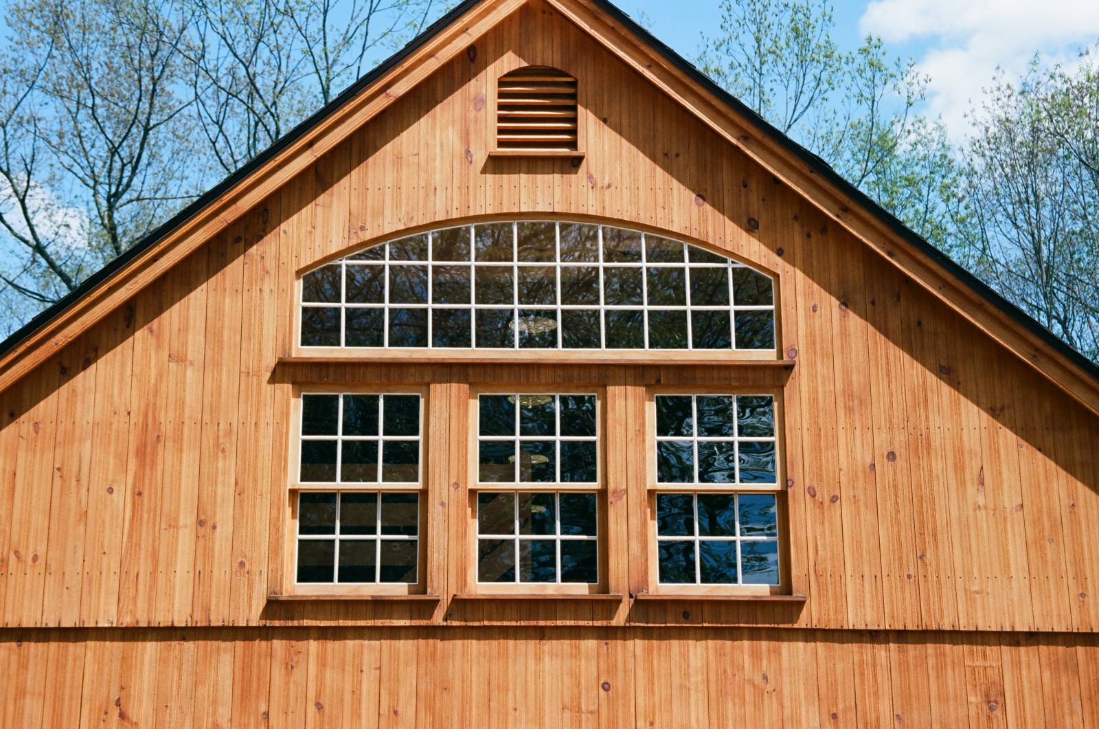 Arched bow top window and pine single hung windows