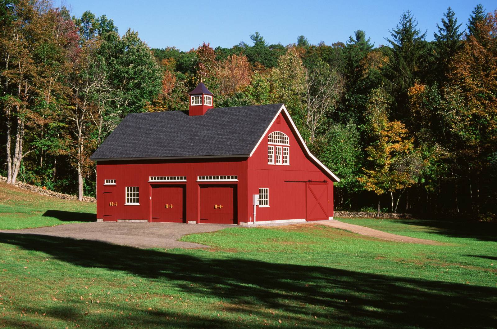 Red Post & Beam Barn in New England Amidst a Stunning Backdrop of Fall Colors