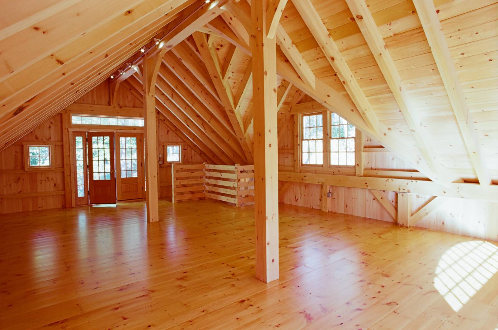 Spacious & bright post & beam bank barn second floor interior • structural ridge • exposed timbers
