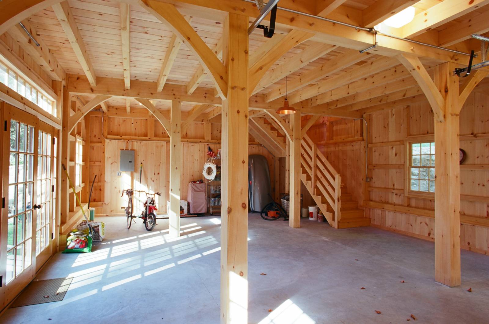 The bank barn is built into a hillside (notice the foundation wall in this first floor photo that has been hidden with shiplap pine)
