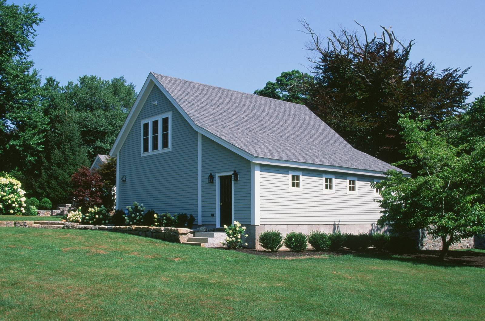 Barn Painted Light Gray-Blue with White Trim & Black Doors to Match the House • 10' Enclosed Lean-To with 4 Square Windows • Entry Door