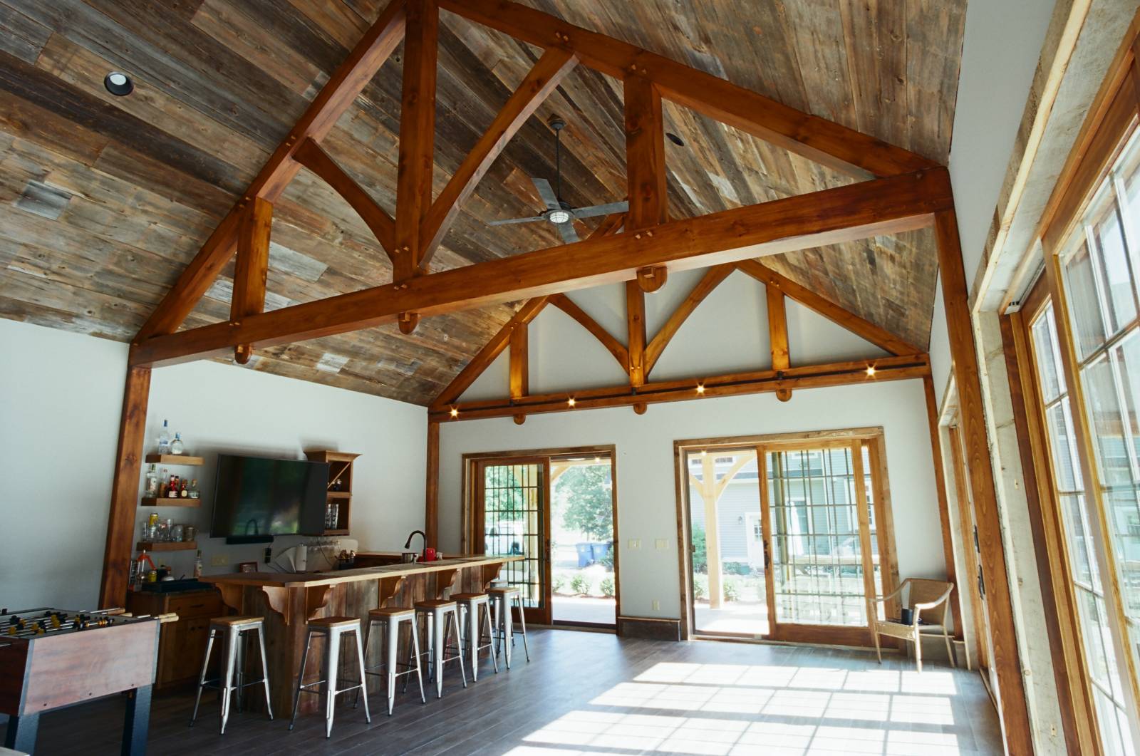 Interior of the Pool House • 24' Timber Trusses with Straight Bottom Chord • Reclaimed Barn Board Ceiling