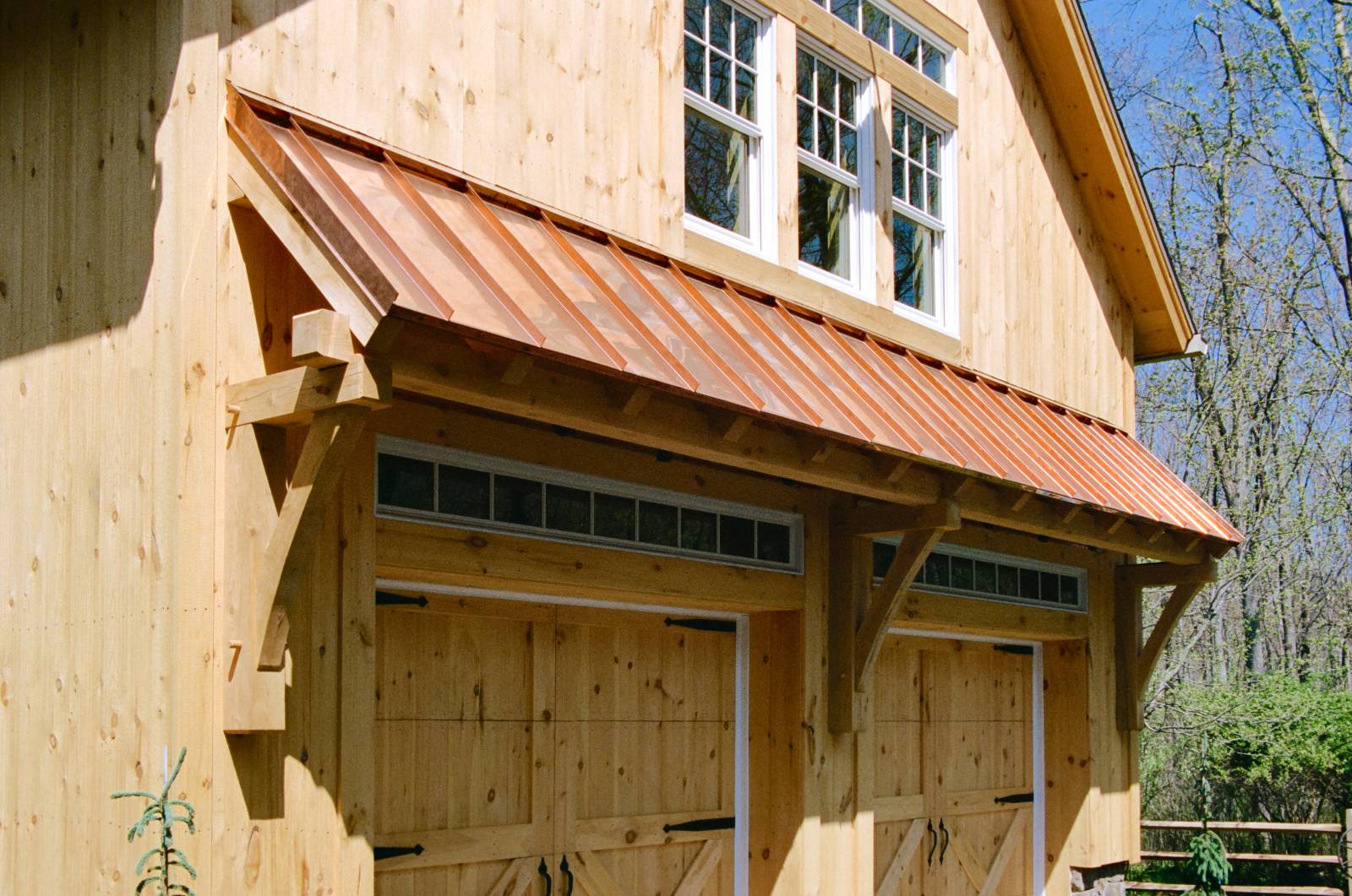 Timber Frame Eyebrow Roof with Copper Standing Seam