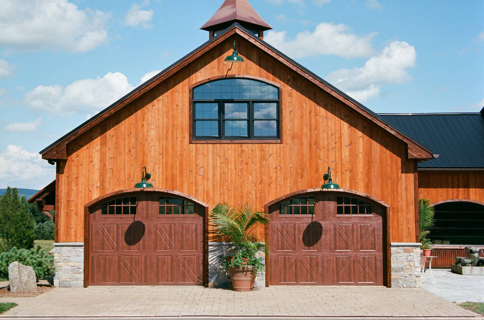 Two Car Attached Garage with Arched Garage Door Openings & Arched Bow Top Window