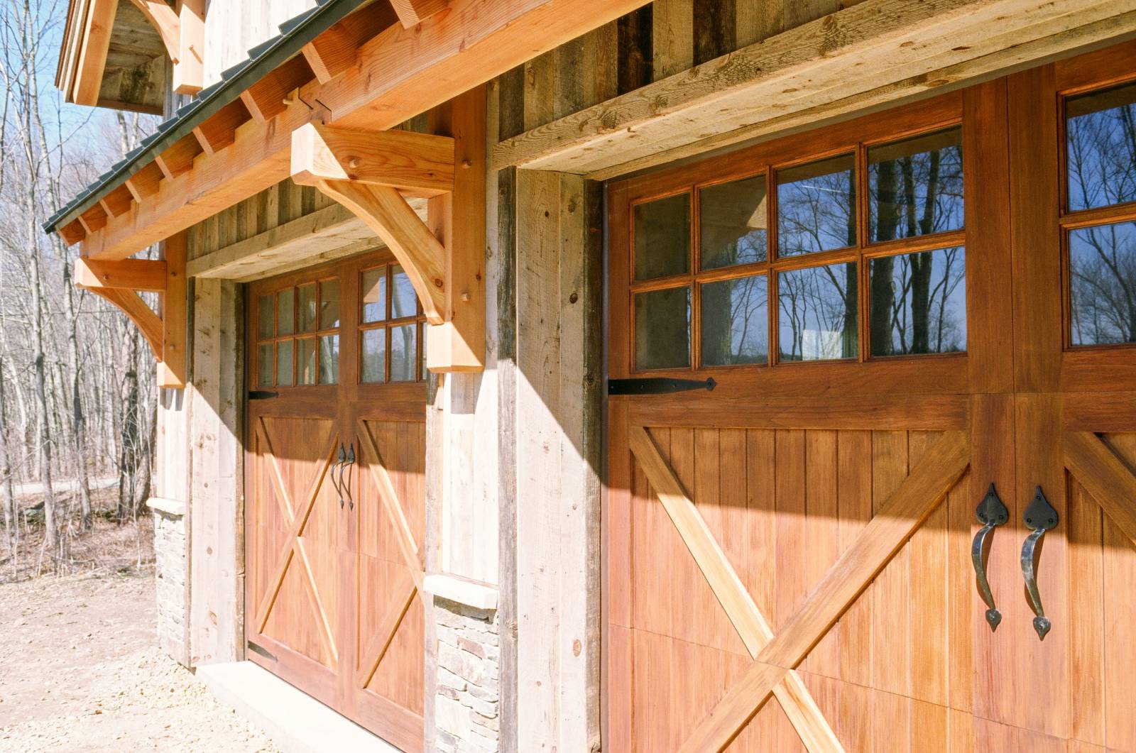 Spanish Cedar Overhead Doors with Douglas Fir Timber Frame Eyebrow Roof