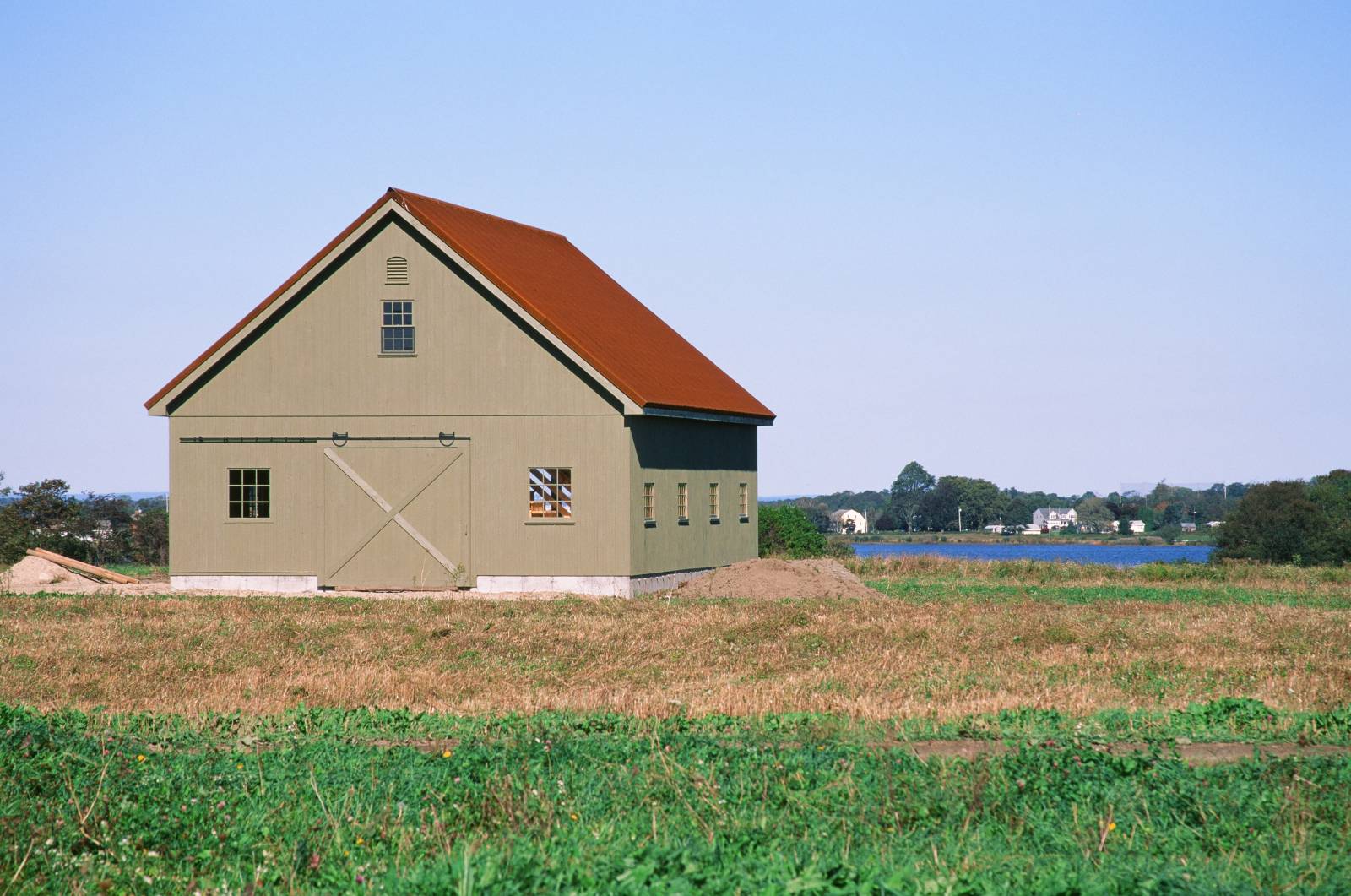 Post & Beam Barn with Sliding Barn Door • Pine Single Hung & Sash Windows • Rustic Corrugated Metal Roofing • Ocean Views