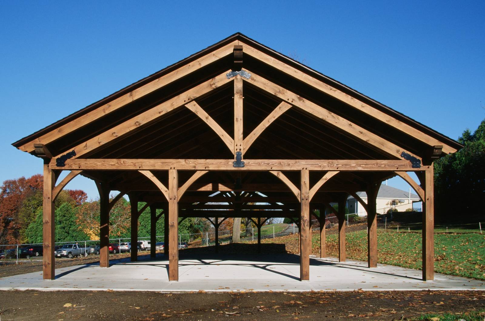 6-12 Roof Pitch • King Post Trusses • Arched Braces • Decorative Rafter Tails