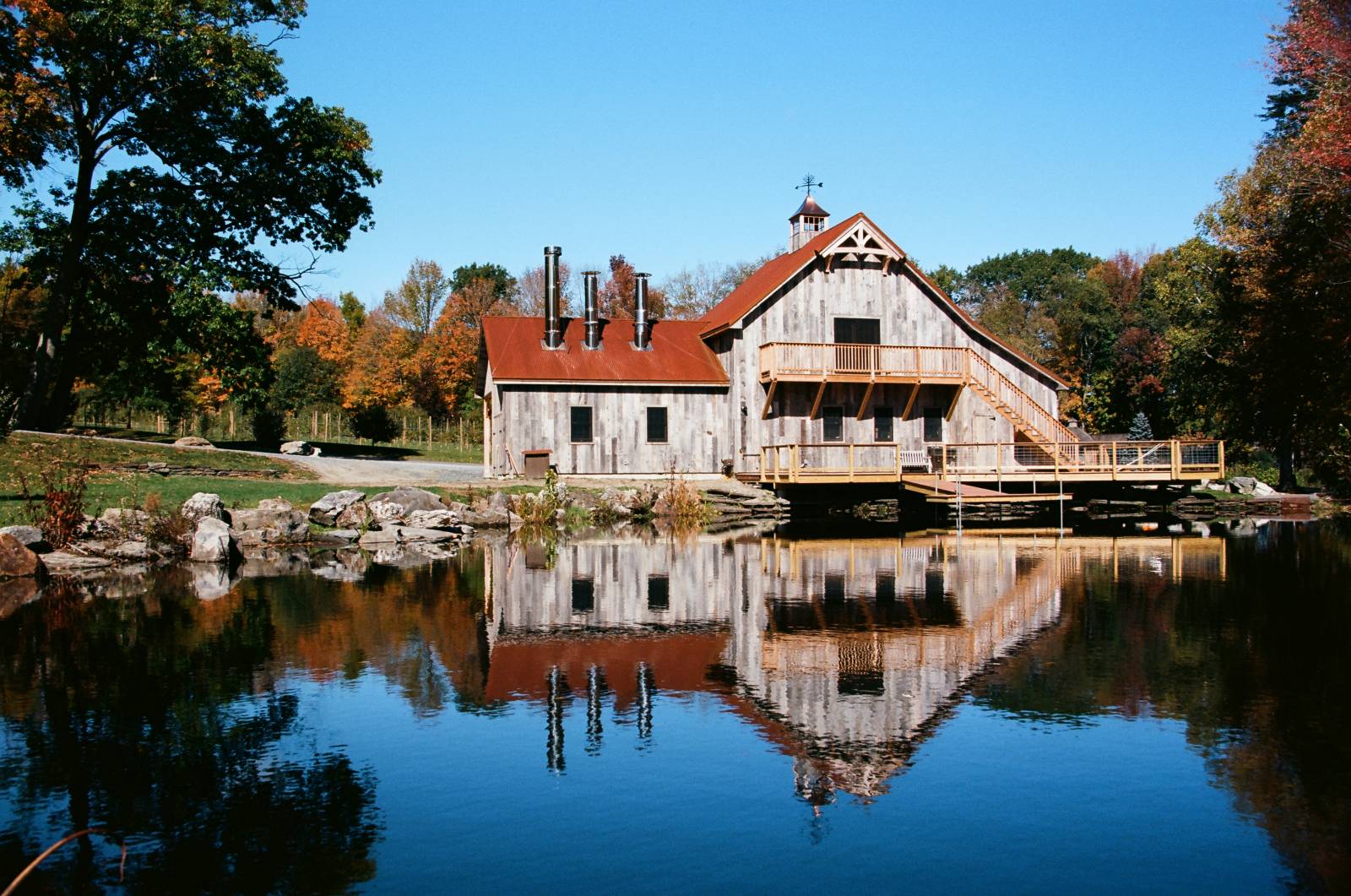 Scenic Location •Â Like a Picture Postcard of New England • Maple Syrup Barn Reflecting off a Pond with Fall Colors Around