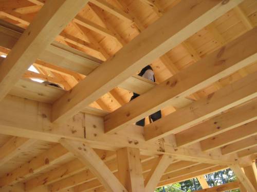 Dovetailed floor joists flush with the top of the 8x12 tie beams