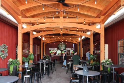 Wine CafÃ© inside the 18' x 60' Curved Roof Timber Frame Pavilion