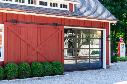 Sliding Barn Door Opens to Reveal Glass Garage Door