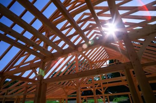 The sun peeks through the timber frame