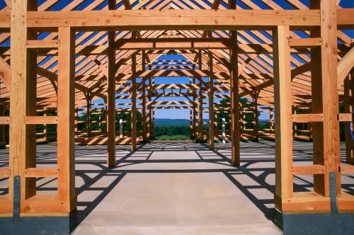 Photo showing the expansive timber frame structure from the center aisle