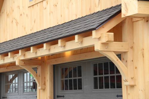 Timber frame eyebrow roof detail
