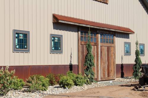 Faux sliding barn doors with landscaping