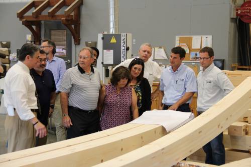 The group looking at arched beams that will be in the pavilion