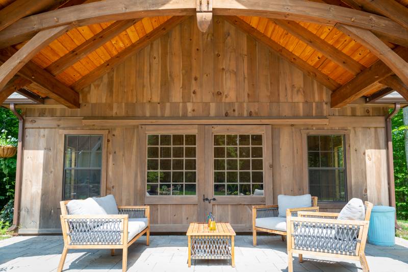 Seating Area under the Overhang • Sliding Barn Doors with 20-Lite Glass