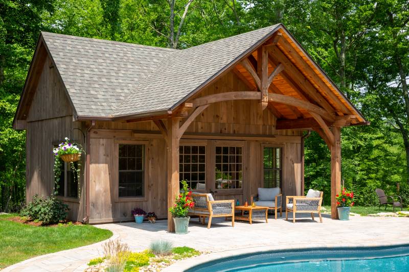 Grand Victorian Pool House with Rustic Stained Pine Siding • Timber Frame Front Overhang • Sliding Barn Doors with 20-Lite Glass
