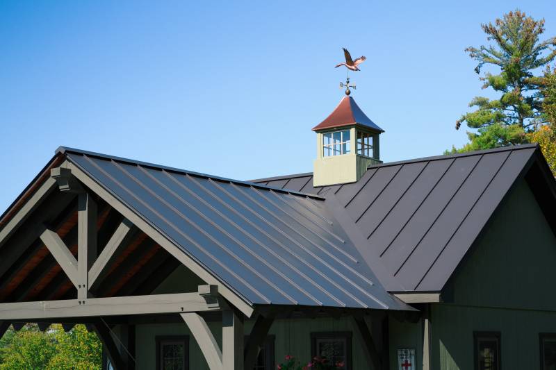 Detail: timber frame porch with standing seam metal roof •Â King post truss design